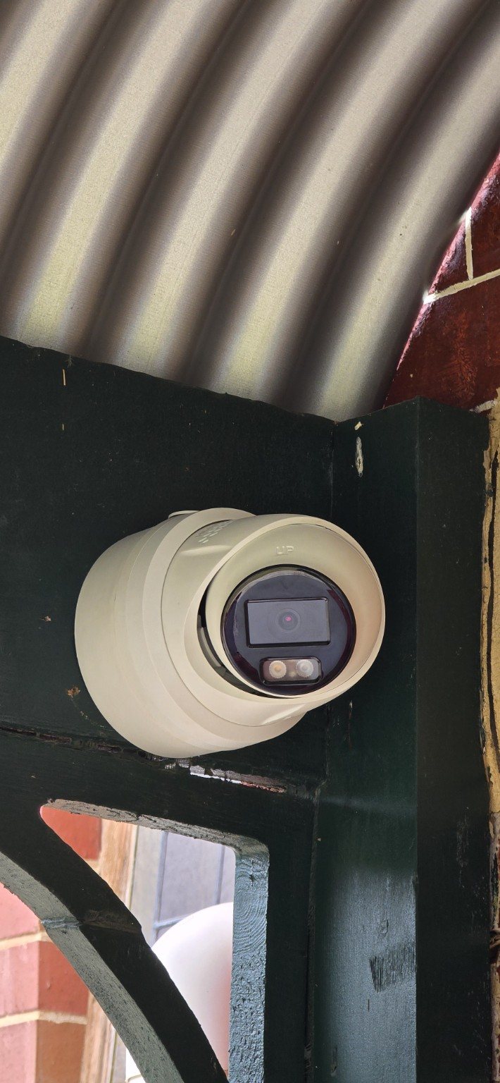 Close-up of a professionally mounted turret security camera