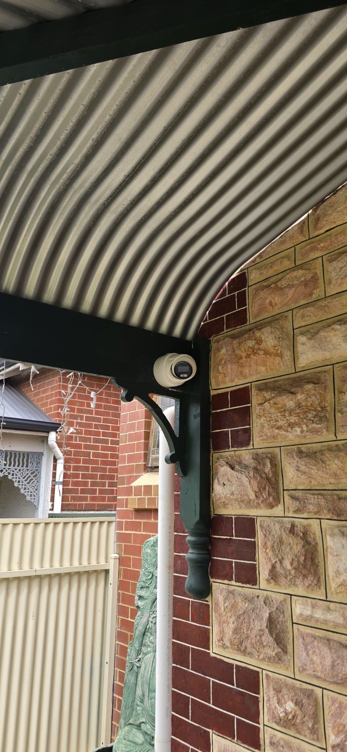 Security camera installed neatly beneath a residential verandah