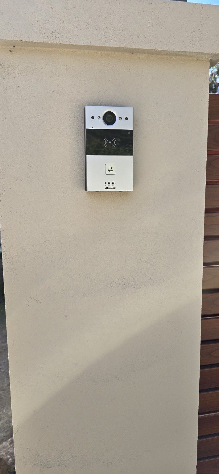 Video intercom mounted neatly on a rendered entrance pillar